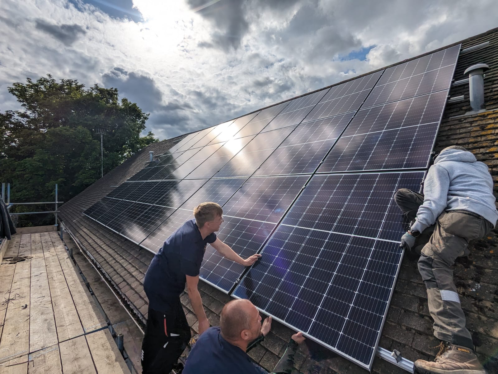 Technicians carrying out building services installation